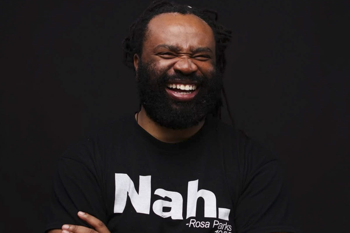 A bearded black with an enormous smile.