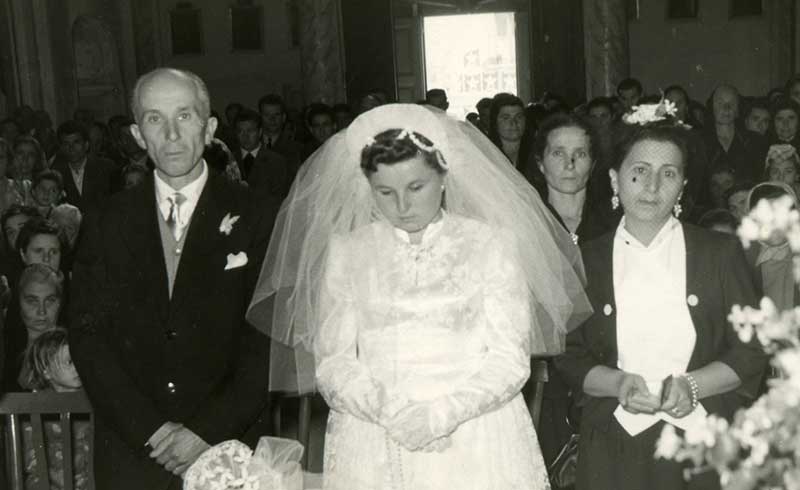 Photograph of Maria Disipio (née Stenta) on her wedding day in Casacanditella, Abruzzo, Italy, October 1953, with her father Giuseppe, maid of honour and mother Carolina standing behind to her left. Canadian Museum of Immigration at Pier 21 (DI2013.1901.3)