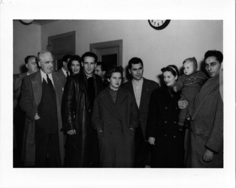 First Hungarian refugees with Immigration officer William A. McFaul at the former Montreal–Dorval airport, Montreal, Quebec, November 1956. Canadian Museum of Immigration at Pier 21 (D2014.10.9).