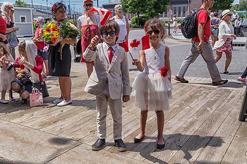 A boy and girl dressed in red and white for Canada Day celebrations.