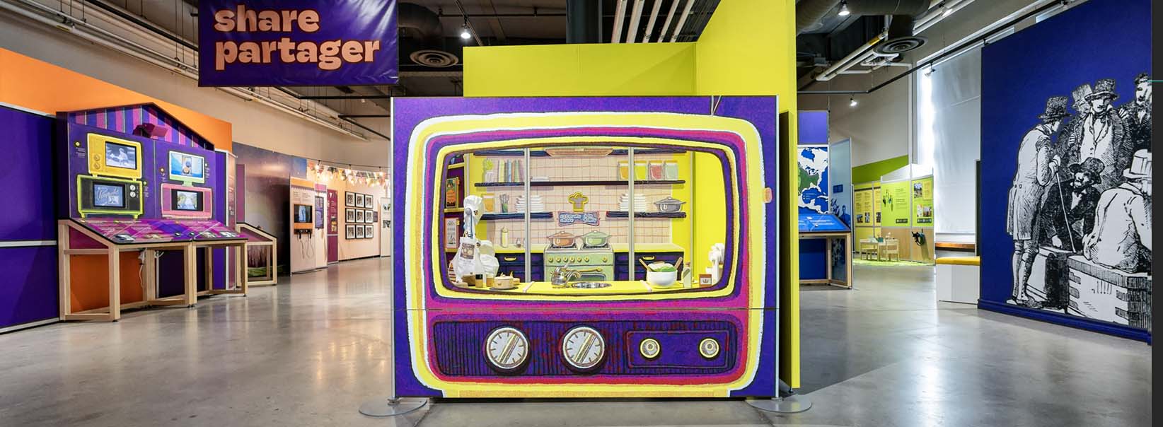 A large panel depicting a TV in the eat make share exhibition, with a model kitchen for visitors to act out a cooking show.