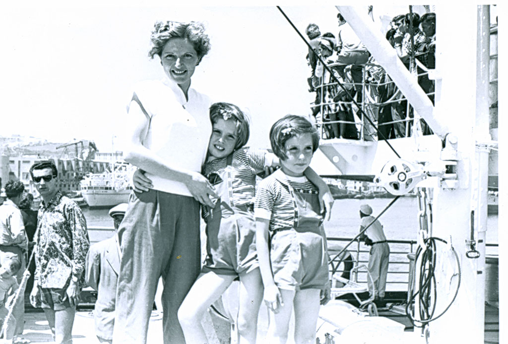 Very unclear archive photo showing a woman and two children.