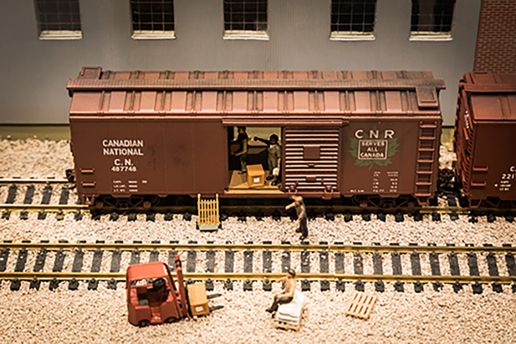 Three different depictions of the Pier 21 Model that is on display at the Canadian Museum of Immigration at Pier 21.