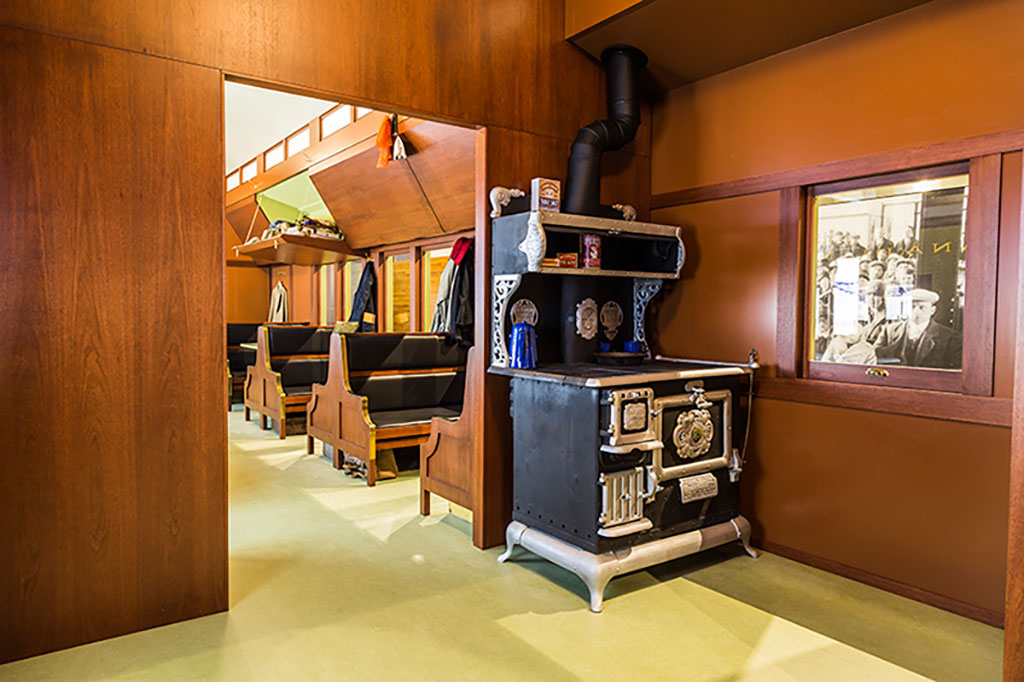 The inside of the replica of the train has an old wood oven.