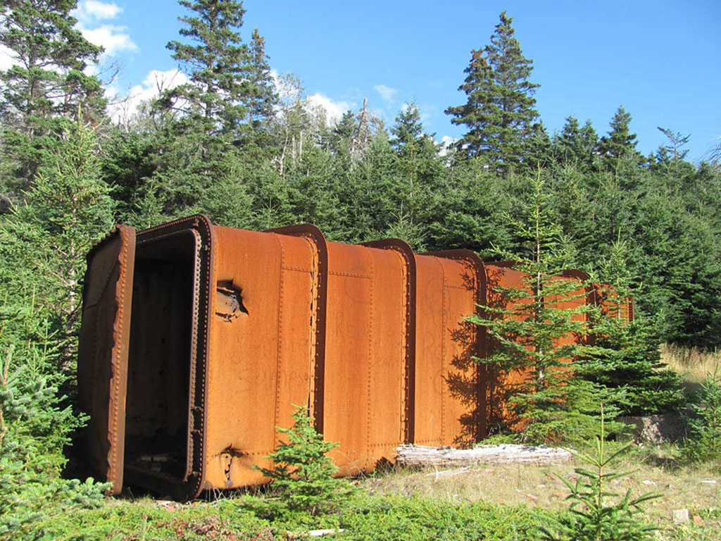 A close-up of one of the rusty, abandoned structures.