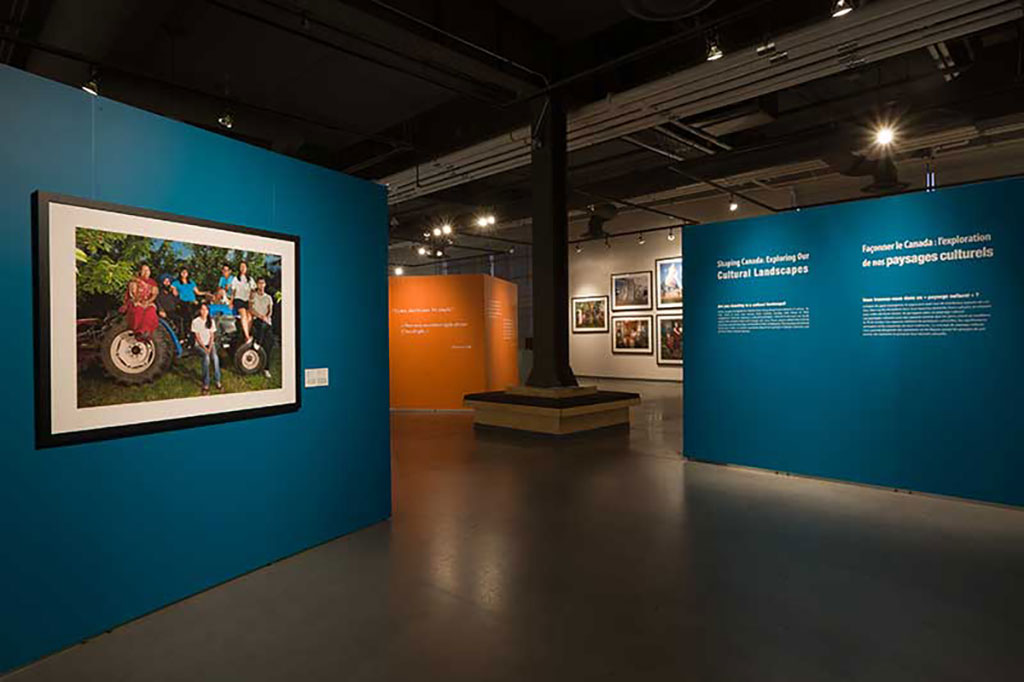 Teal-coloured walls of an exhibition on Cultural Landscapes.