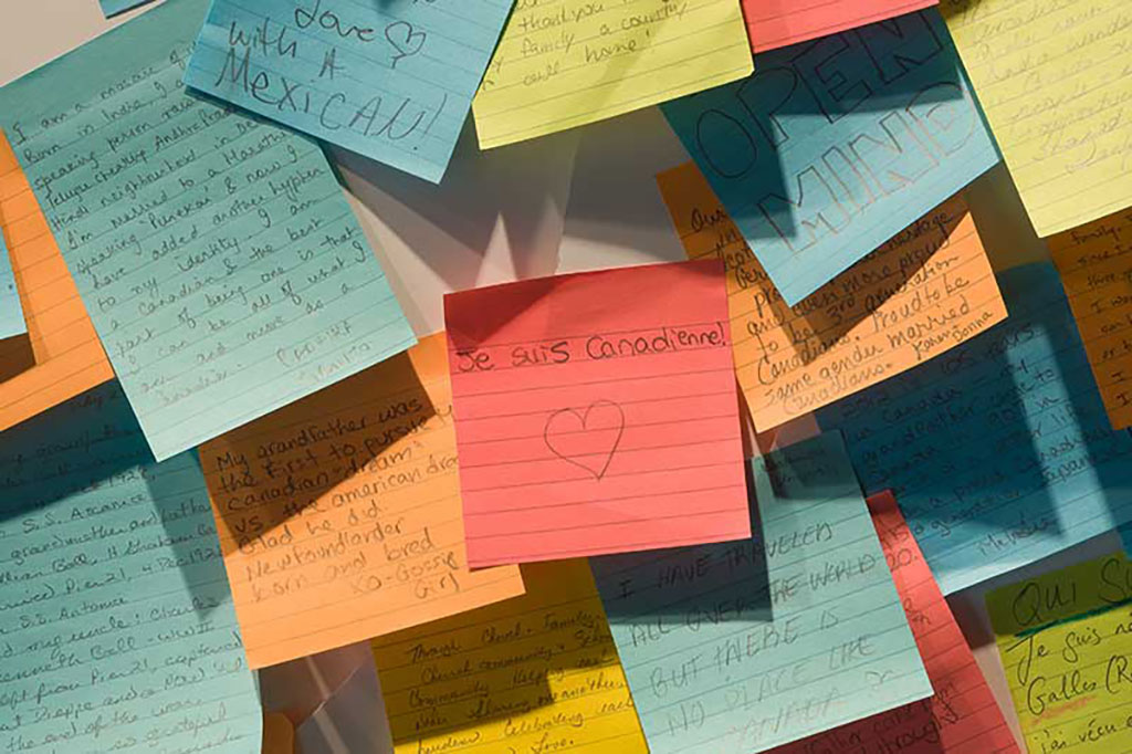 Different pieces of lined post-it notes with various messages written on them.