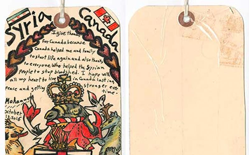 A luggage tag with images and writing on it. The tag is dated October 13, 2016, and says Syria and Canada on the top.