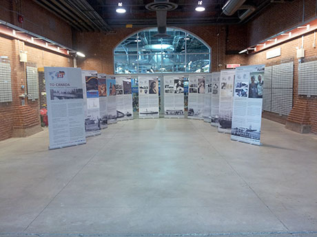 A large exhibition area, showing 12 pop-up banners with lots of text and photos.