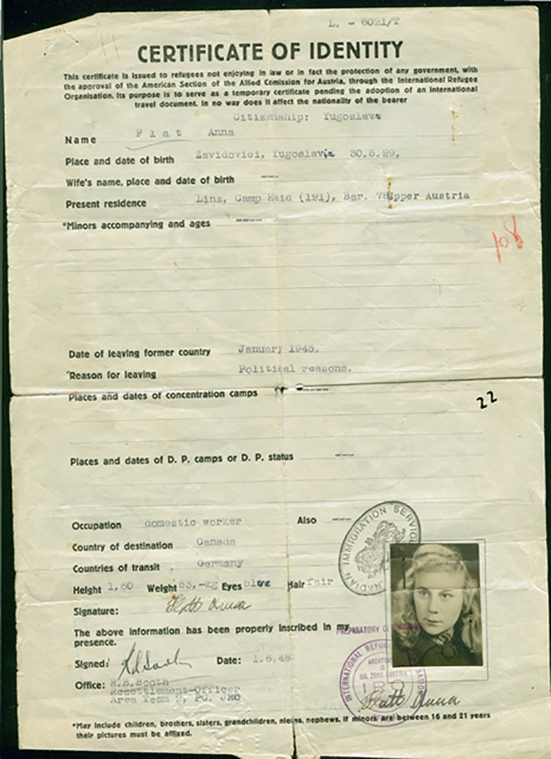 A typed piece of paper with identifying information and a photo of a woman.