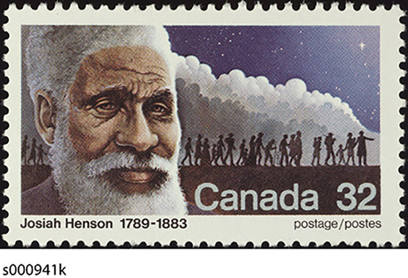 An African American with greying hair and beard is depicted on a Canadian stamp, several silhouettes of people can be seen in the background.