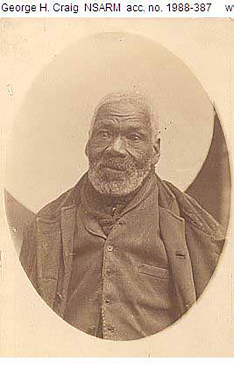 A portrait of an African American man captured in an oval-shaped frame.