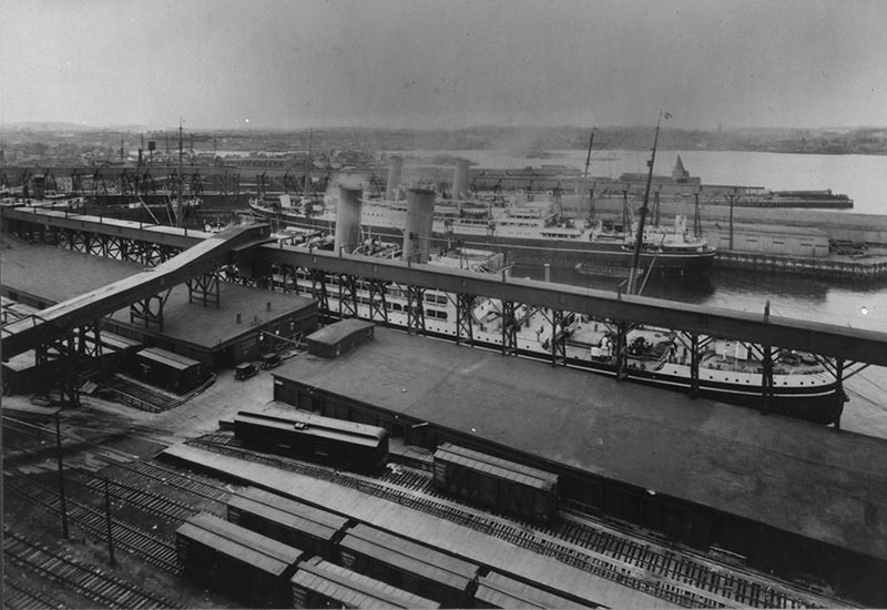 A ship can be seen in this archival image of Saint John harbour, as well as train cars.