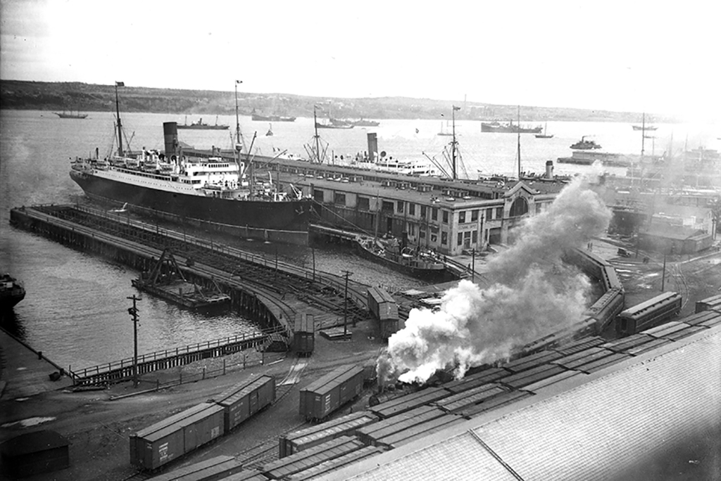 Archival image of harbourfront with lots of activity.