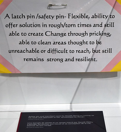 A safety pin on display as a exhibit artifact
