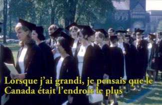 A line up of graduate students in caps and gowns.