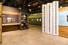 A long view of the Pier 21 Story exhibition space including a train car.