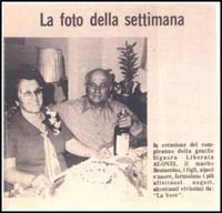 Italian newspaper article featuring man and woman with cake and champagne.