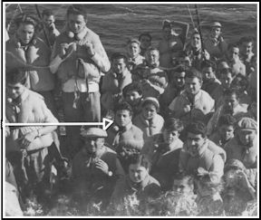 Several young men and women on board, arriving at port in life jackets.