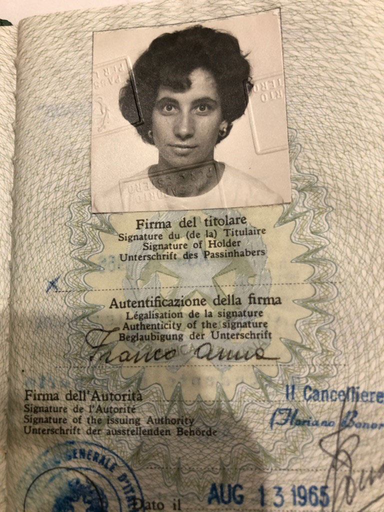Passport page with photo of a young woman.