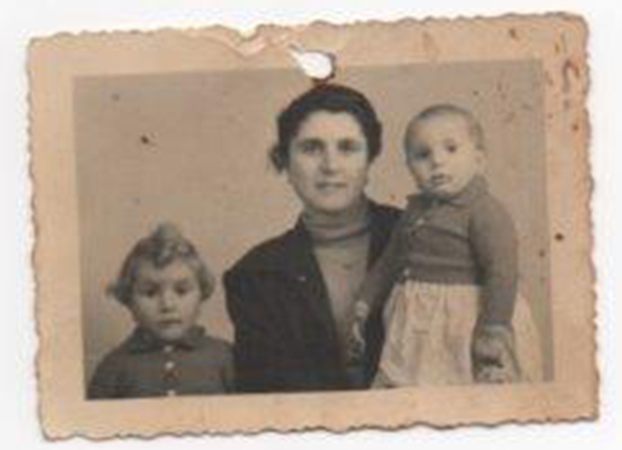 Old photo of beautiful lady with two kids.