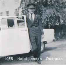 Bruno in doorman uniform and cap, standing next to open door of car.