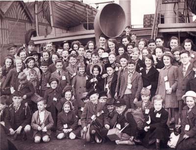 Large group shot of young boys and girls aboard the SS Bayano.