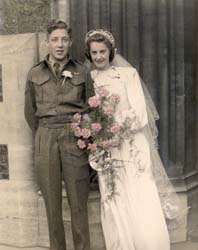 Frances and Chuck on their wedding day, standing outside the church.