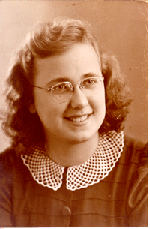 Sepia-toned portrait of young Cornelia, with frilly collar and glasses