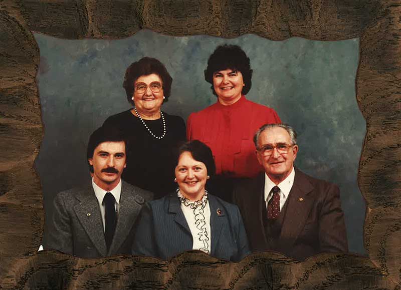 Here is a family portrait of a man and woman and their three adult children.