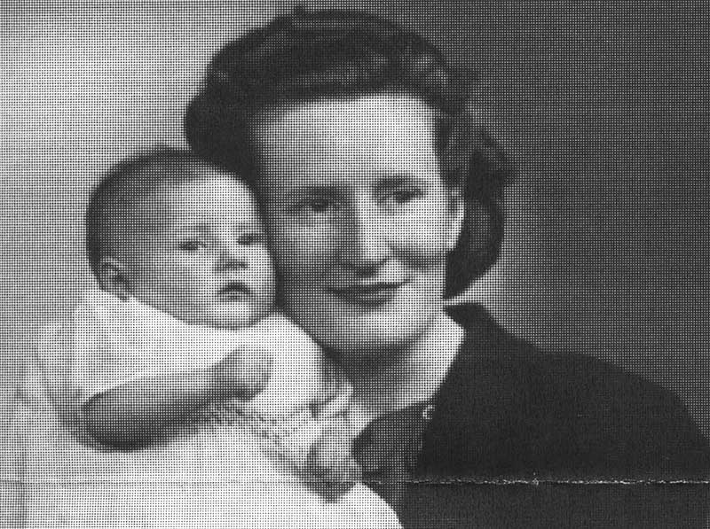 Black and white portrait of young woman holding a baby.