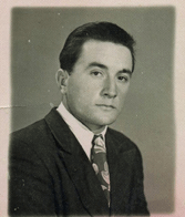 Portrait of young Pompilio in suit and tie.