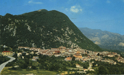 Beautiful aerial view of Italian town on green mountain.