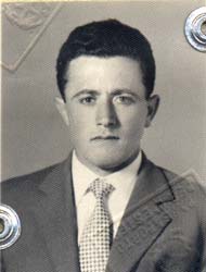 Passport photo of young man in suit and tie.