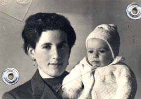 Passport photo of young woman with small baby, baby wearing white knitted cap and sweater.
