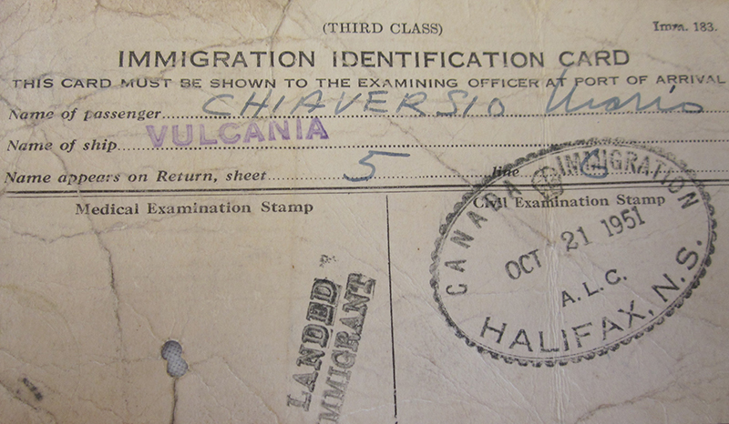Immigration identification card with canada immigration halifax stamp.