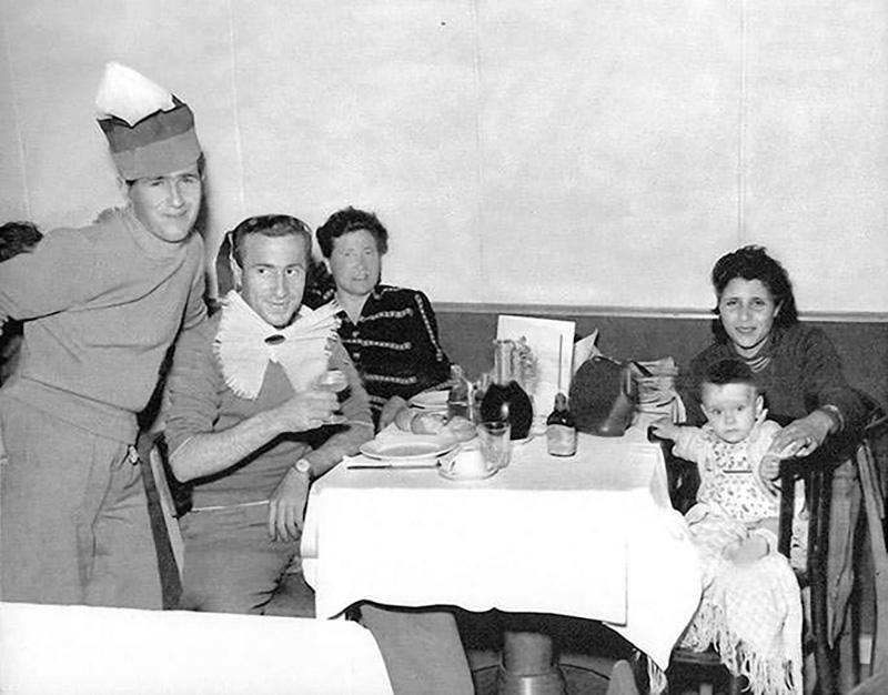 Black and White photograph from June 15, 1953, shows group dinning aboard the passenger ship Saturnia.