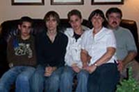 Recent coloured photo of five Damiani family members seated on couch.