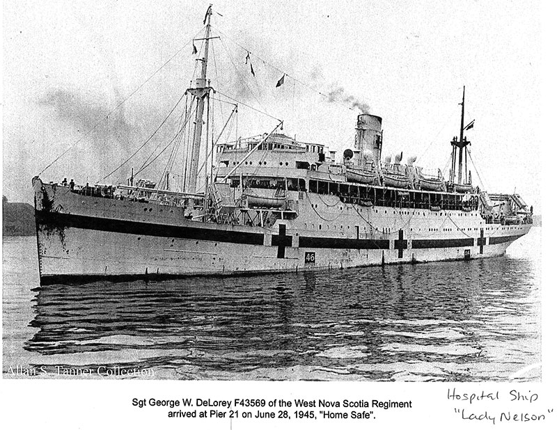 Archival image of a hospital ship with images of the red cross on its sides.