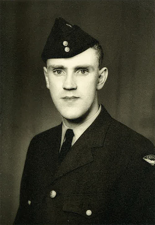 Military portrait of young soldier in uniform.