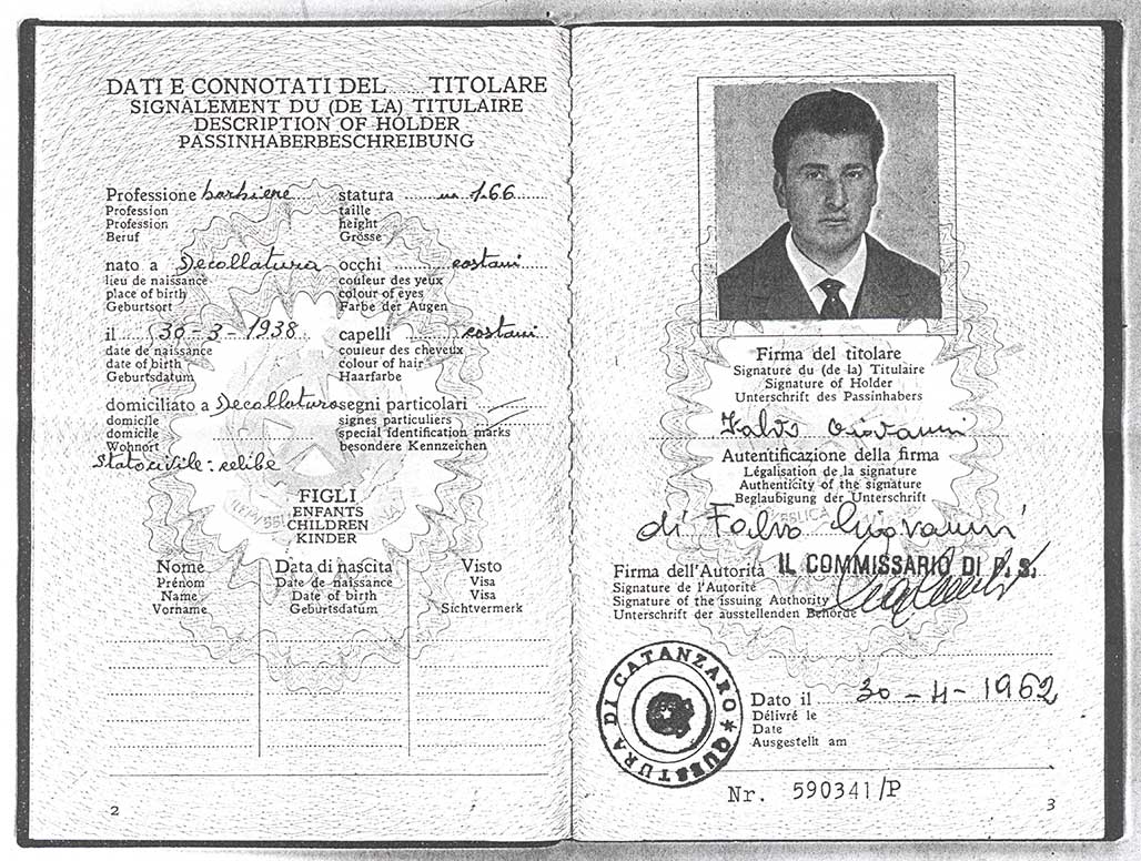 Old passport showing a young man and lots of Italian writing.