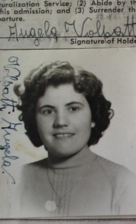Identity photograph of young Angela, wearing a turtleneck and a pendant.