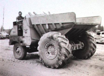 Giovanni as a young man, driving a huge tractor.