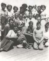Group photo showing several men, women and children.