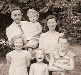 Old family photograph of a man, a woman and four children.