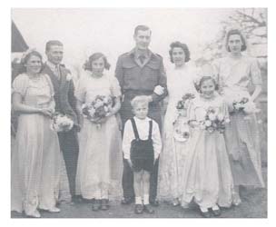Bridal party with bride, groom, brides' maids, flower girl and ring bearer.