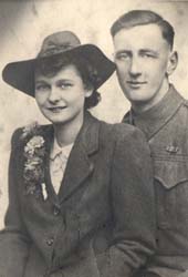 Wedding portrait of Irene, wearing a hat, and her husband Reginald.
