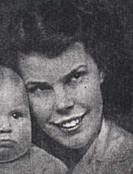 Black and white photo of young woman with baby.