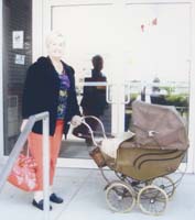 Older Jean, donating her baby pram to Pier 21.