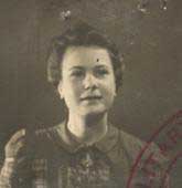 Old passport photo of a woman, it has the markings of a stamp.